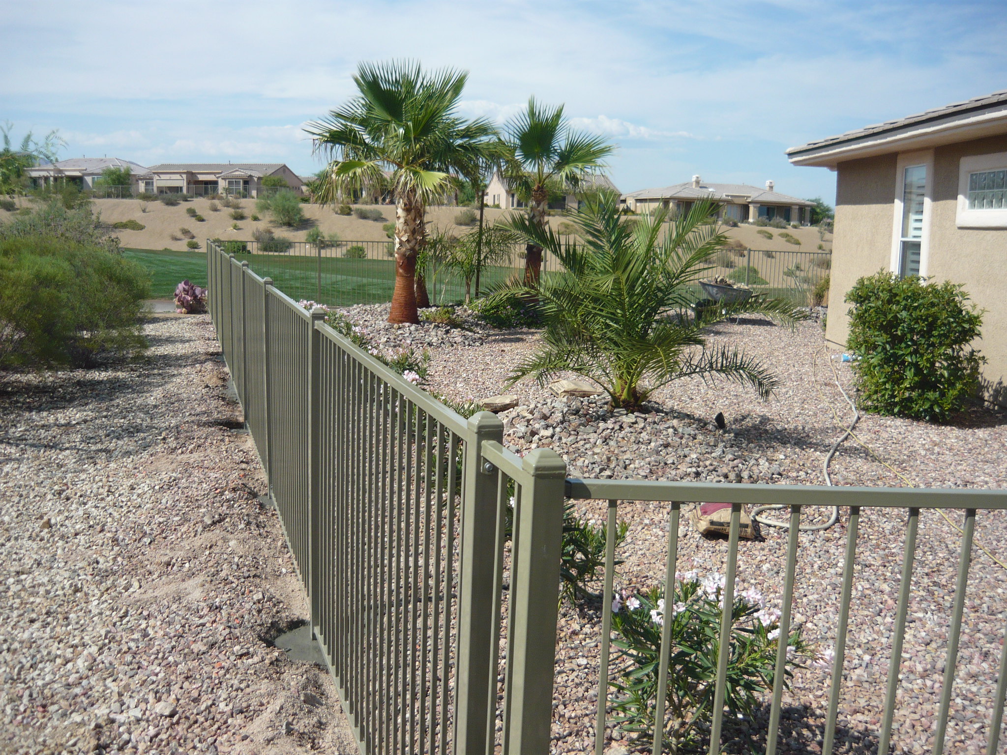 powder coated fence around desert landscaped backyard