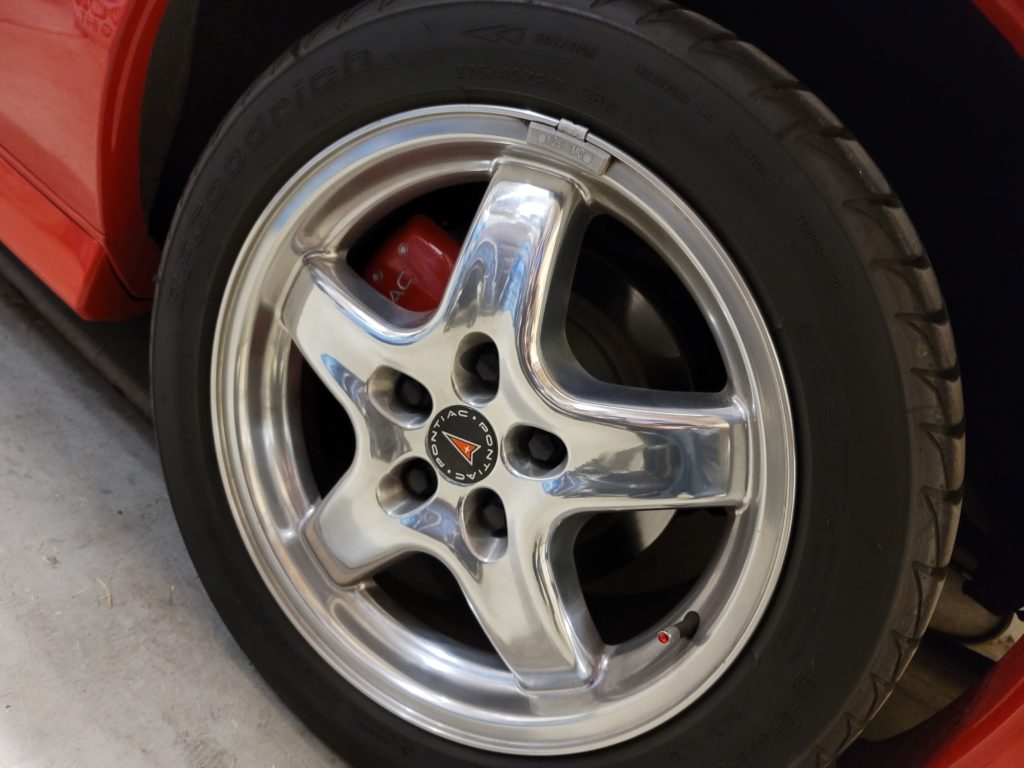 restored pontiac tire rim