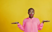 woman looking curious against a yellow background