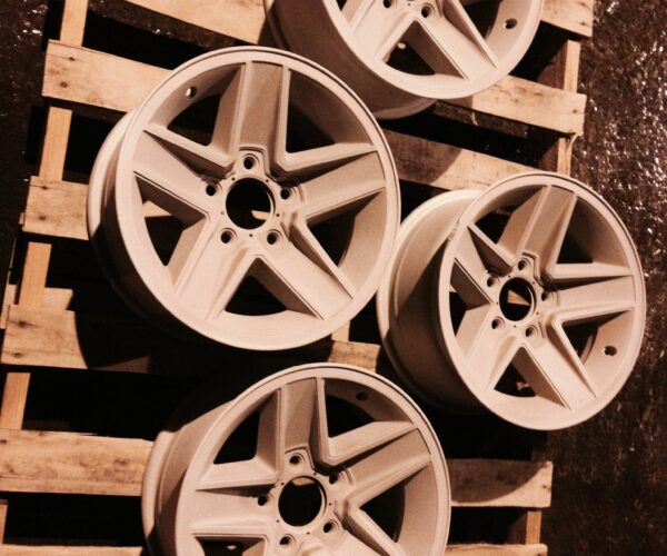 arpowder-wheels-mediablast 4 car wheels resting on a wooden pallet